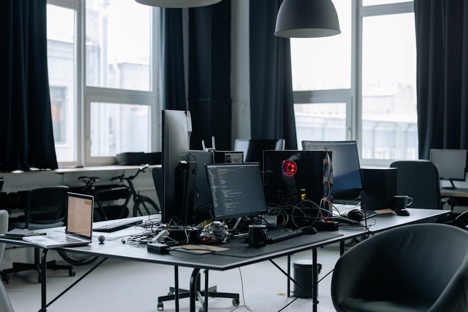 Contemporary workspace featuring computers and coding screens
