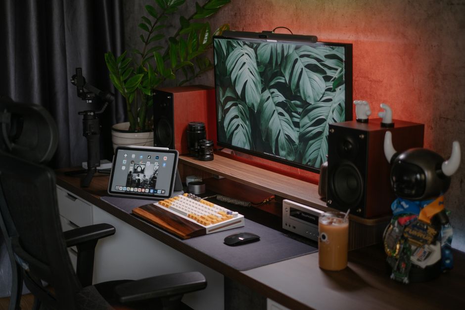 A stylish home office setup featuring a monitor and tablet